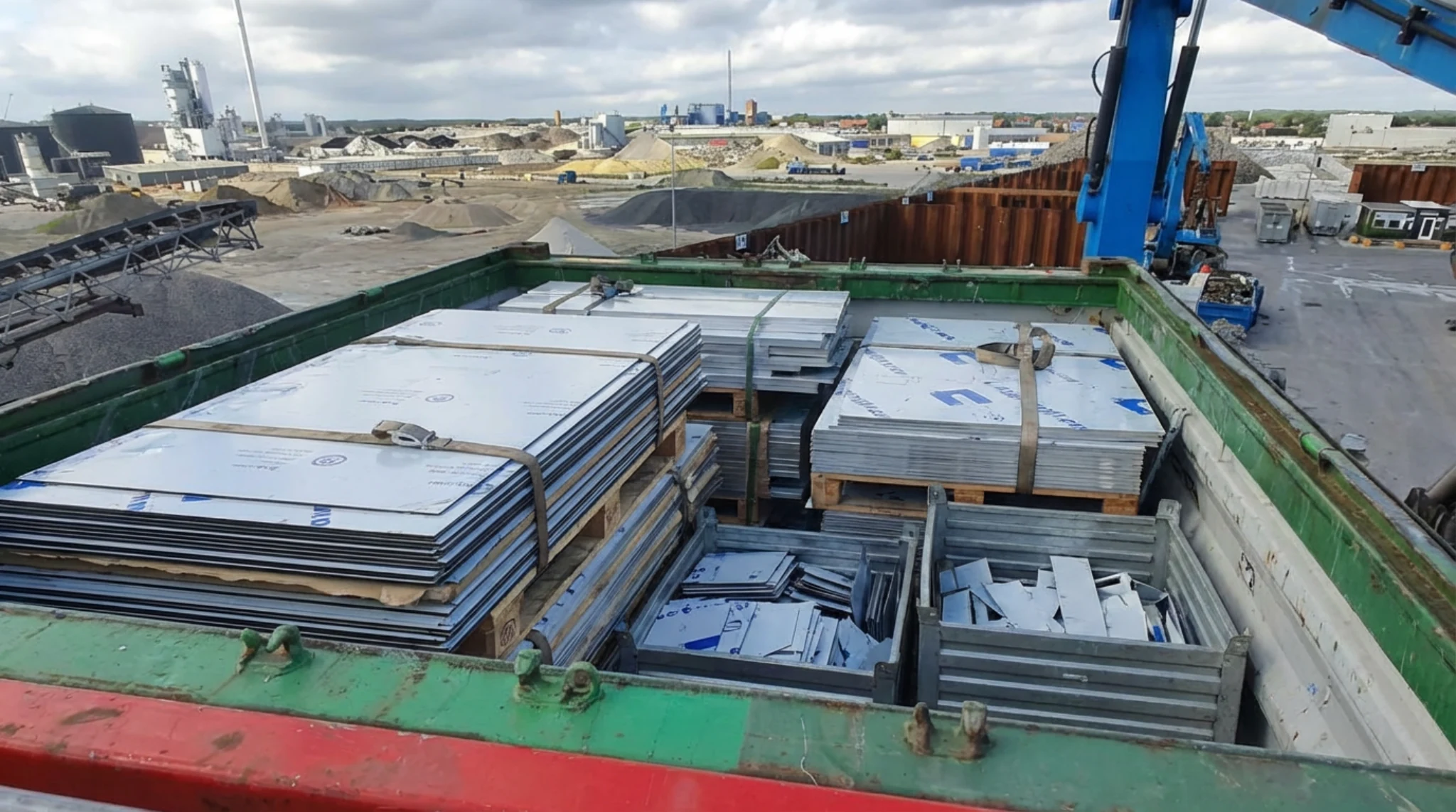 ACM and sign-panel material staged for recurring pickup