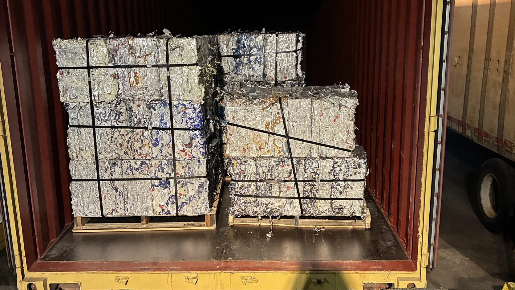 Prepared industrial aluminum bales staged for container loading