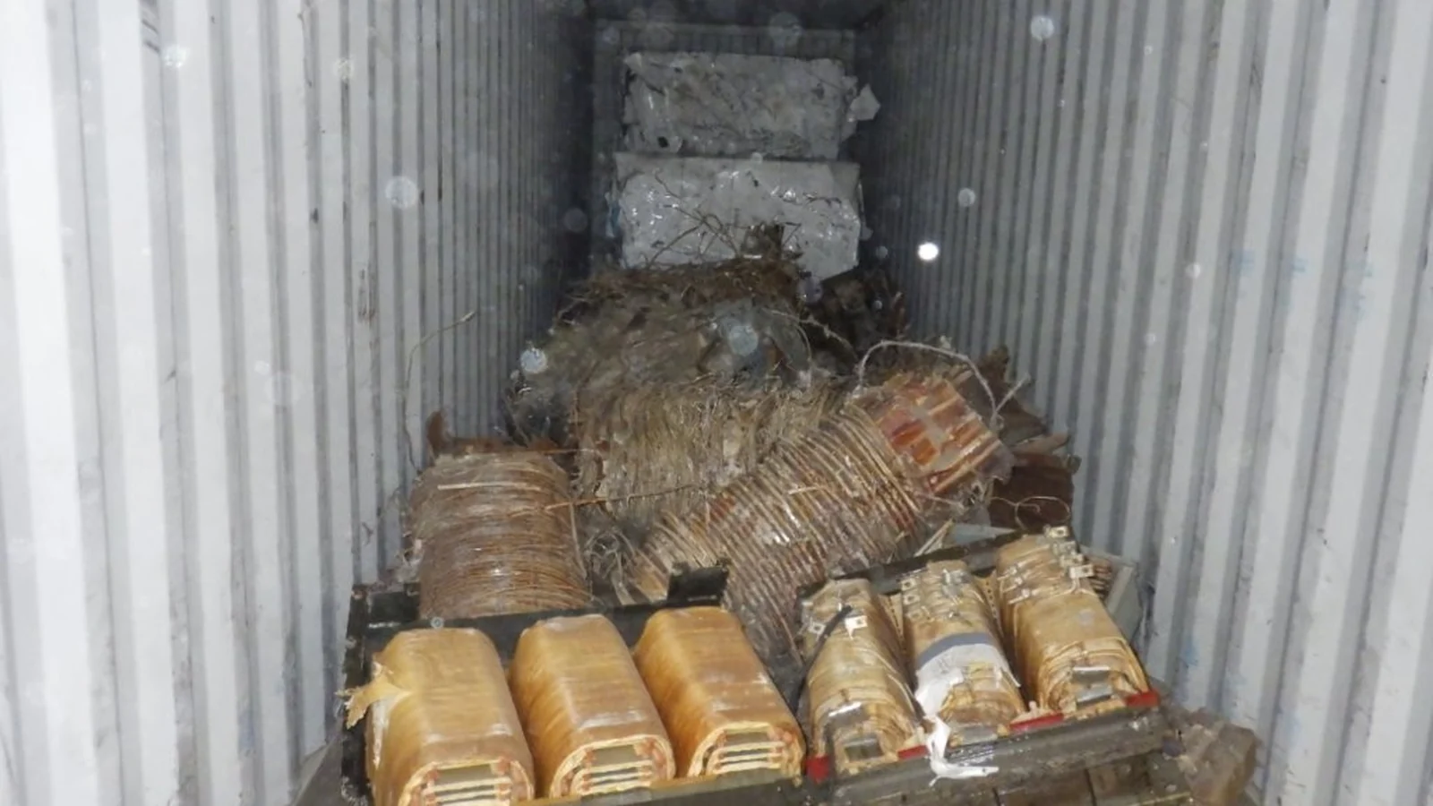 Aluminum-rich transformer material prepared inside a shipping container